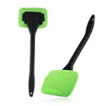 Two black long-handle cleaning brushes with green microfiber plush pads for car and home gap dust removal