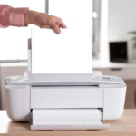 White compact desktop inkjet printer with automatic paper feed tray, used for clear document printing in home and small office working scenarios