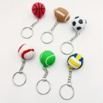 Six mini rubber sport ball shaped keychains including basketball rugby soccer baseball tennis volleyball for fan bag decoration