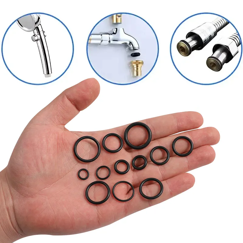 Assorted black rubber O-rings in palm, replacement sealing gaskets for bathroom faucet, shower head and water pipe leak repair