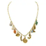 Gold paperclip chain necklace with assorted ocean-themed shell, seahorse, starfish and mermaid tail charms