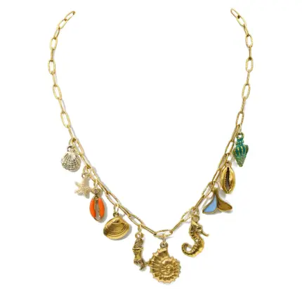 Gold paperclip chain necklace with assorted ocean-themed shell, seahorse, starfish and mermaid tail charms