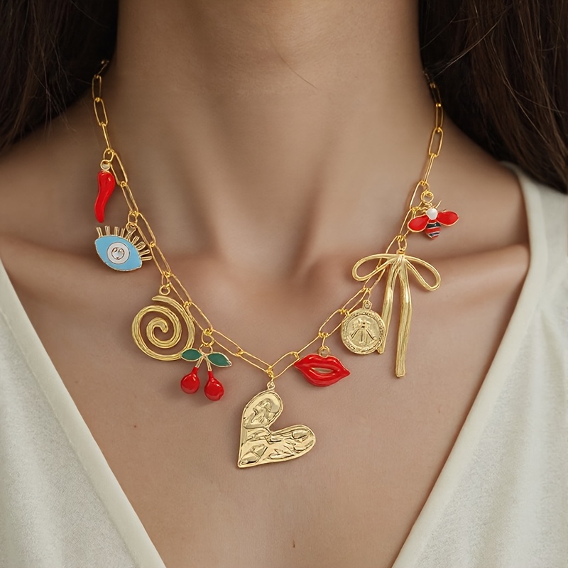 Gold paperclip chain necklace with enamel lips, evil eye, cherry, textured heart, spiral and bow decorative pendants for women party styling