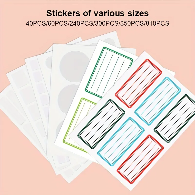 Assorted rectangular lined blank write-on labels and round dot self-adhesive sticker sheets stacked on light pink background