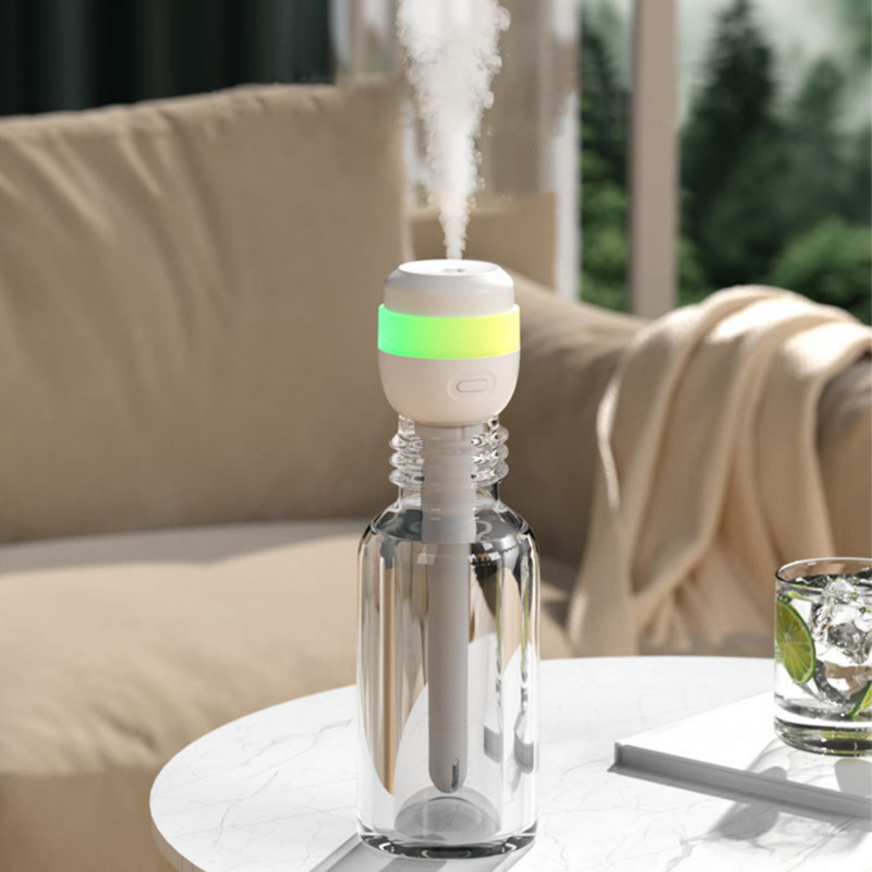 Portable plug-in bottle humidifier with glowing color night light emitting mist, placed on indoor living room table for home dry air moisturizing